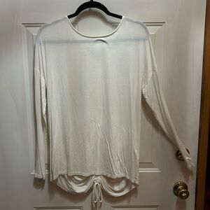 Long sleeved, off-white shirt with gathered back